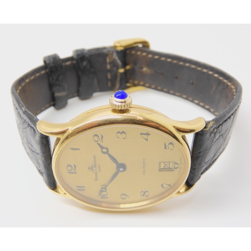 2902 - AN 18CT GOLD BAUME & MERCIER BAUMATICgents watch, with oval gold coloured dial, black hands and ... 