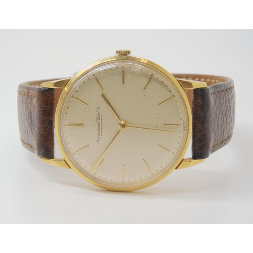 2906 - AN INTERNATIONAL WATCH CO GENTS WATCHthe 18ct gold case with Swiss hallmarks has a cream dial with g... 