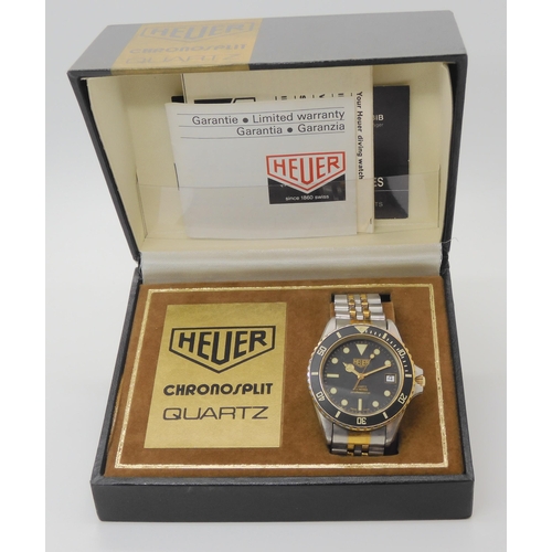 2908 - A VINTAGE HEUER WRISTWATCHcirca 1983, steel and gold plate diver's watch.  The watch has a black dia... 