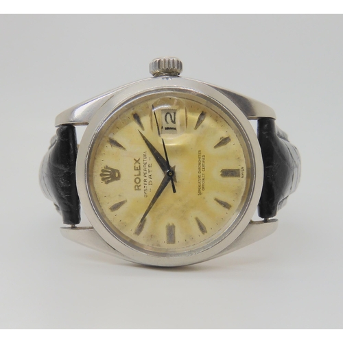2910 - A ROLEX OYSTER PERPETUAL DATEwith cream patinaed dial, dagger indexes and date aperture. Diameter of... 