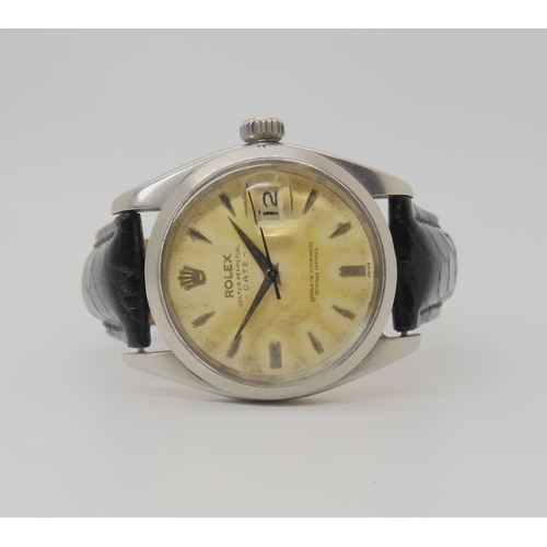 2910 - A ROLEX OYSTER PERPETUAL DATEwith cream patinaed dial, dagger indexes and date aperture. Diameter of... 