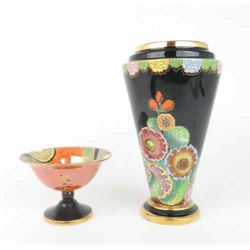 2165 - A CARLTON WARE HOLLYHOCKS PATTERN VASEof tapering form with black ground and green interior, pattern... 