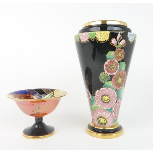 2165 - A CARLTON WARE HOLLYHOCKS PATTERN VASEof tapering form with black ground and green interior, pattern... 