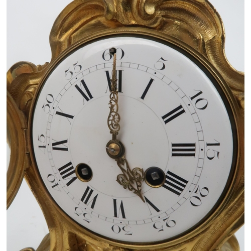 2175 - A FRENCH ORMOLU ROCOCO STYLE TIMEPIECEthe white dial with roman numerals, the movement stamped with ... 