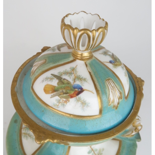 2178 - A CROWN DERBY PORCELAIN URN AND COVERthe white ground with three panels painted with hummingbirds am... 