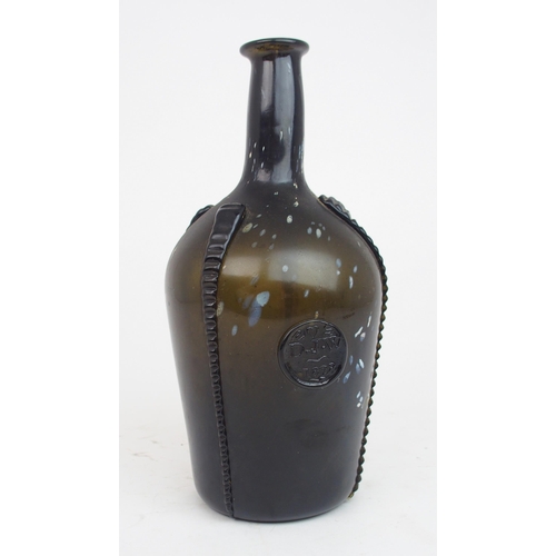 2181 - AN EARLY 19TH CENTURY ALLOA GLASS WINE BOTTLEin dark olive green mottled with white splashes, with f... 