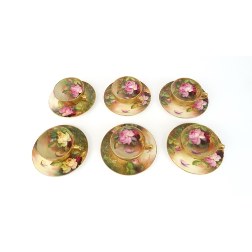 2186 - A ROYAL WORCESTER BOXED SET OF SIX DEMITASSE COFFEE CUPS AND SAUCERSeach painted with roses in a nat... 
