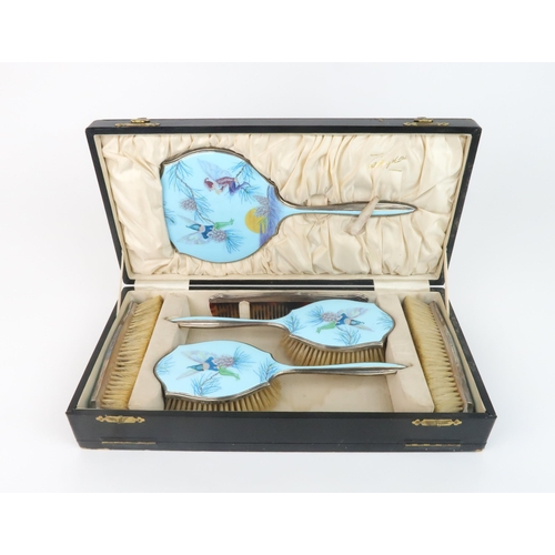 2188 - AN ENAMELLED AND SILVER DRESSING TABLE SETwith a design after an illustration by Margaret W Tarrant ... 