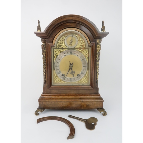2203 - AN EARLY 20TH CENTURY WINTERHALDER & HOFMEIER BRACKET CLOCKthe arched dial with silvered chapter... 