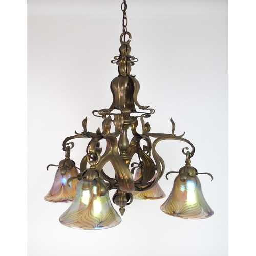 2204 - A BRASS ARTS AND CRAFTS HANGING LIGHTwith later iridescent glass shades, 56.6cm x 59cm high, 104 cm ... 