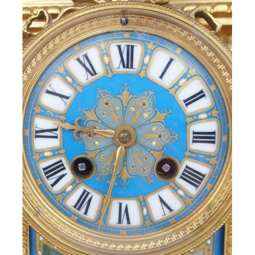 2233 - A SEVRES STYLE CLOCK GARNITUREthe clock with turquoise porcelain dial and panels, one painted with a... 