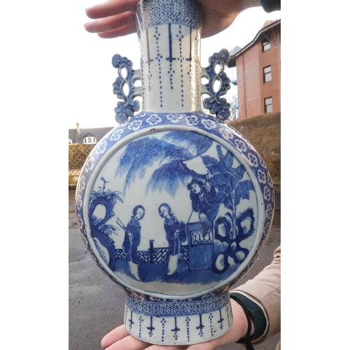 2358 - A CHINESE BLUE AND WHITE PILGRIM BOTTLE painted with panels of figures in gardens within a blossom g... 