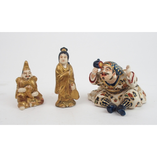 2365 - A SATSUMA FIGURE MODELLED AS DAIKOKU seated and holding his mallet, 8.5cm high, a figure seated hold... 