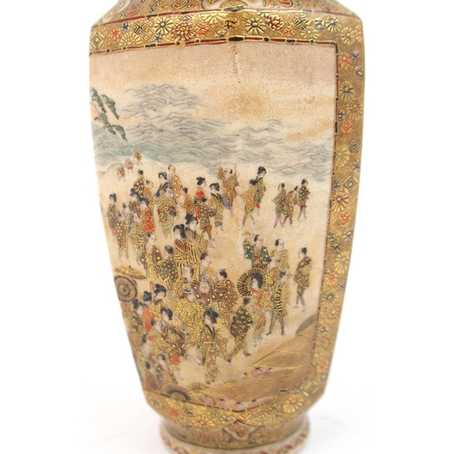 2373 - A SATSUMA HEXAGONAL VASE painted with two highly detailed panels of celebrations within dense foliag... 