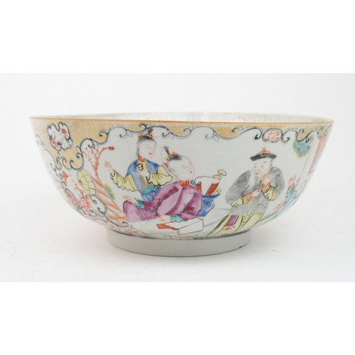 2377 - A CHINESE FAMILLE ROSE PUNCH BOWL painted with figures within scrolling panels and diaper, 26cm diam... 