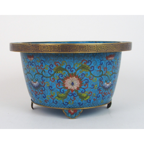 2381 - A CHINESE CLOISONNE PLANTER decorated with peonies and scrolling foliage, beneath key pattern and on... 