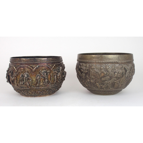 2387 - A BURMESE SILVER BOWLof rounded form, with profusely embossed and repousse work of villagers, warrio... 