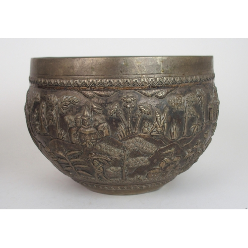 2387 - A BURMESE SILVER BOWLof rounded form, with profusely embossed and repousse work of villagers, warrio... 