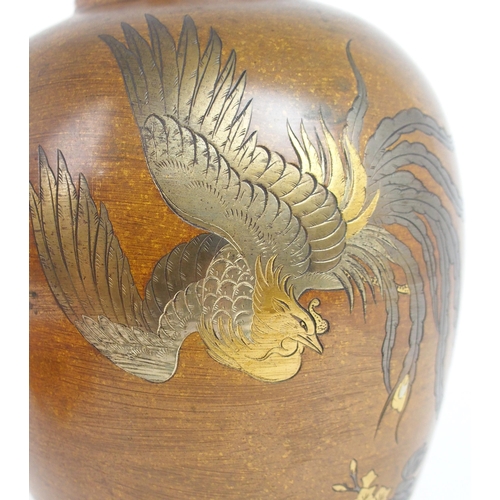 2389 - A JAPANESE BRONZE INLAID VASEof ovoid form, with inlaid silvered and gilt decoration of a phoenix / ... 