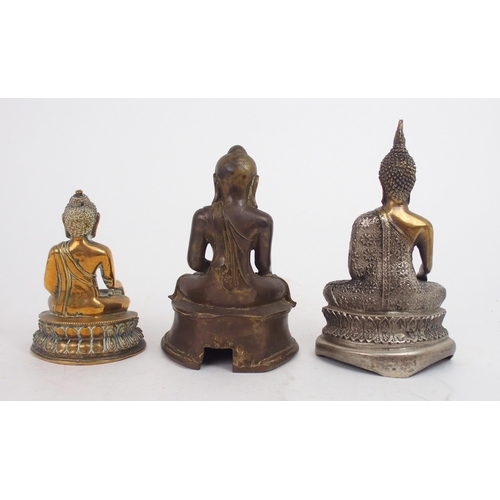 2397 - A BURMESE BRASS BUDDHA seated on a double lotus throne and holding sacred vessel, 15cm high, two oth... 