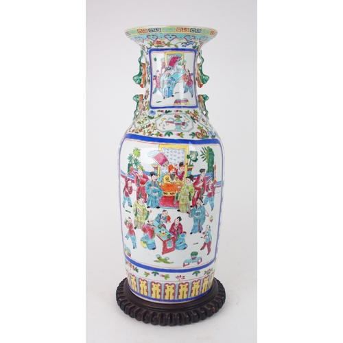 2398 - A CANTONESE BALUSTER VASE painted with court figures surrounded by precious objects and foliage, 20t... 