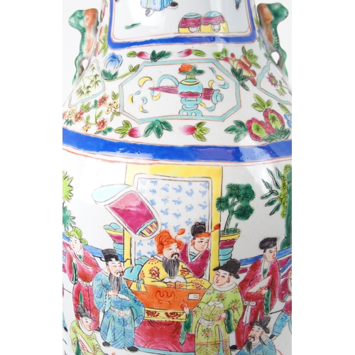 2398 - A CANTONESE BALUSTER VASE painted with court figures surrounded by precious objects and foliage, 20t... 