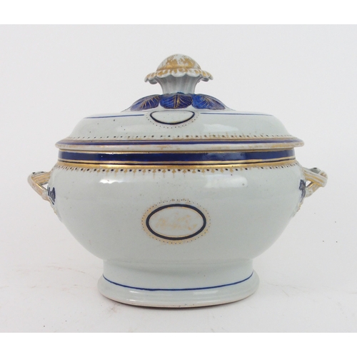 2405 - A CHINESE EXPORT SOUP TUREEN AND COVERpainted with gilt monograms, moulded foliage and entwined bran... 