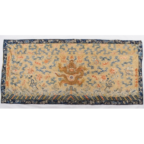 2406 - A CHINESE SILK PANELdecorated in coloured threads on a cream ground within a blue and white border o... 