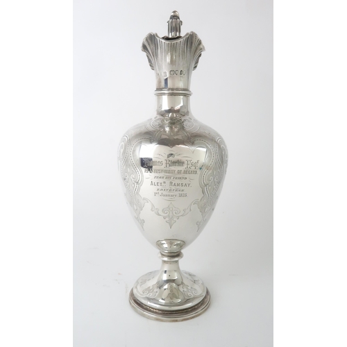 2451 - A VICTORIAN SILVER EWERby Edward & John Barnard, London 1855, of baluster form, the body engrave... 