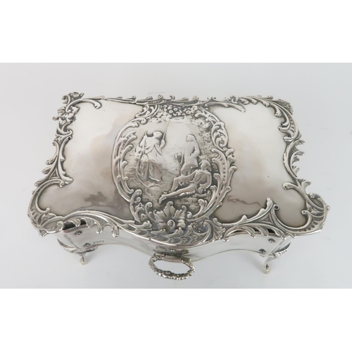 2452 - AN EDWARDIAN SILVER JEWELLERY BOXby William Comyns, Birmingham 1902, in the form of a rococo table, ... 