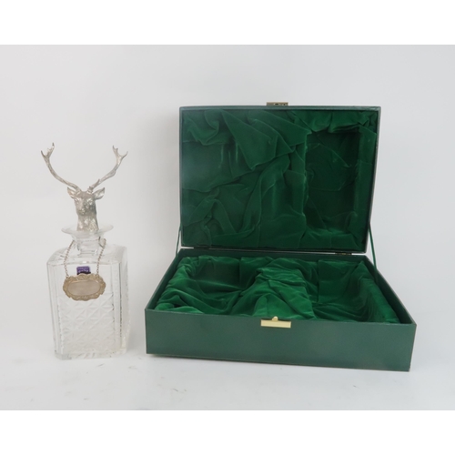 2463 - A CASED EDINBURGH CRYSTAL DECANTERof canted square form, the stopper modelled as a stag, with a silv... 