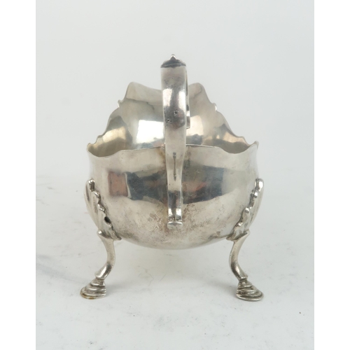 2470 - A GEORGE II SILVER SAUCE BOAT London 1755, maker's mark SM, of helmet form, the body with an engrave... 