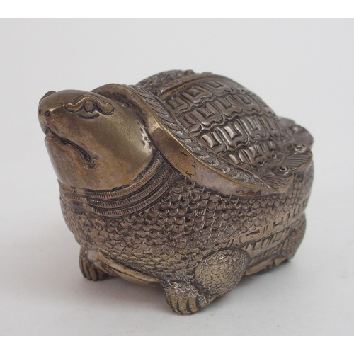 2482 - A CAMBODIAN WHITE METAL ZOOMORPHIC BETEL BOXmodelled as a tortoise, finely embossed and engraved, 19... 