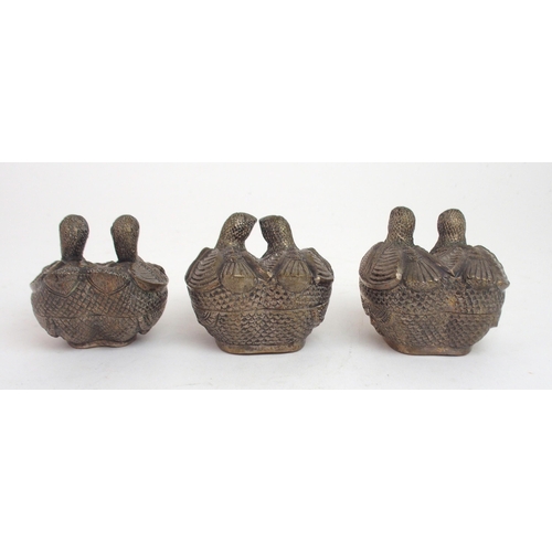 2483 - A TRIO OF CAMBODIAN WHITE METAL ZOOMORPHIC BETEL BOXESmodelled as pairs of quails, finely embossed a... 