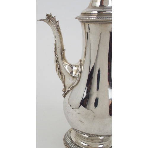 2486 - A GEORGE III SILVER COFFEE POTof baluster form, with a beaded knop finial and a domed lid and gadroo... 