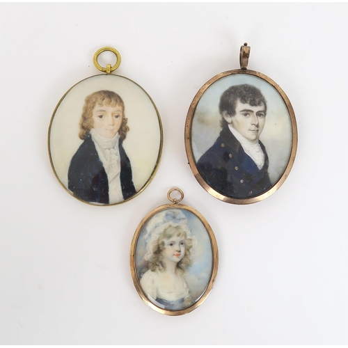 2552 - A GROUP OF THREE EARLY 19TH CENTURY PORTRAIT MINATURES Painted on ivory, depicting respectively a da... 
