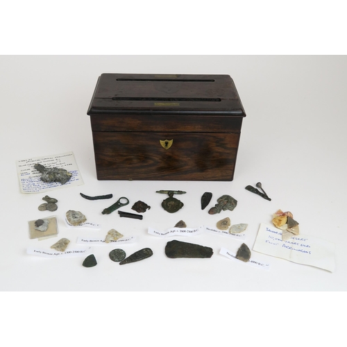 2553 - A ROSEWOOD CORRESPONDENCE BOX, CONTAINING A COLLECTION OF ARCHAEOLOGICAL FINDSThe hinged top with tw... 
