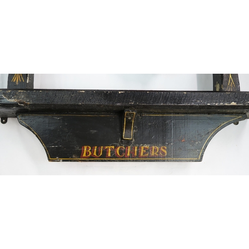2559 - AN EARLY 20TH CENTURY BUTCHER'S SHOP CARVED WOOD WINDOW DISPLAYLargely black-painted, with hanging c... 