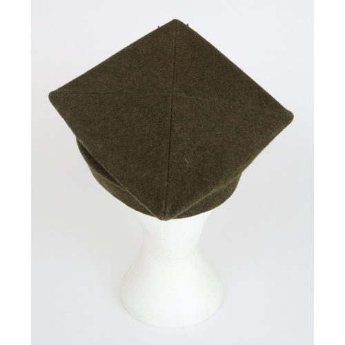 2654 - A POLISH ROGATYWKA CAPOf typical square form, the body of khaki wool over a metal-banded brown leath... 