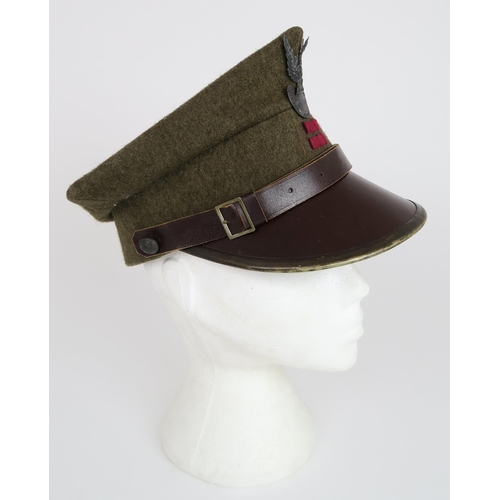 2654 - A POLISH ROGATYWKA CAPOf typical square form, the body of khaki wool over a metal-banded brown leath... 