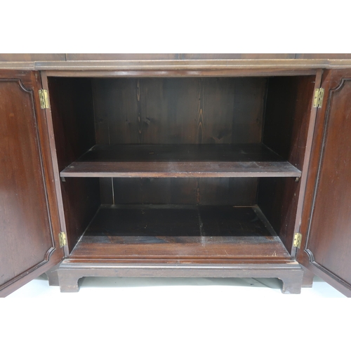 2039 - A 19TH CENTURY MAHOGANY BREAKFRONT BOOKCASEwith moulded cornice over four beaded glazed doors over p... 