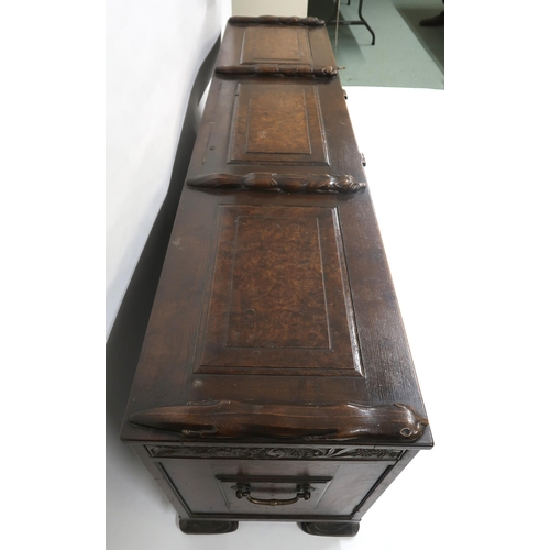 2049 - AN ARTS AND CRAFTS OAK AND BURR WALNUT COFFERthe three section hinged top carved with foxes and rais... 