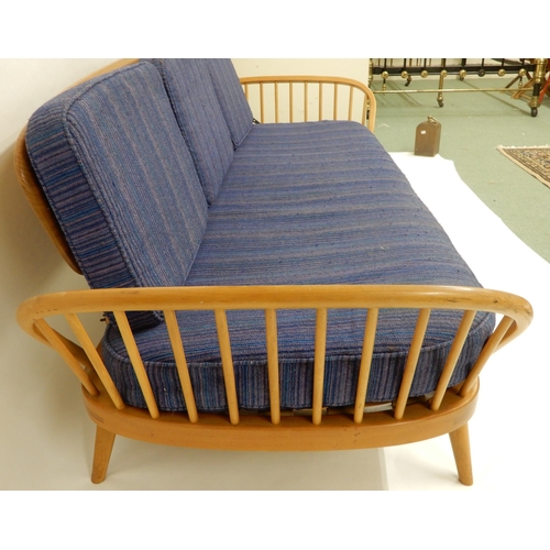 2109 - A MID 20TH CENTURY ELM AND BEECH FRAMED ERCOL DAY BEDwith blue upholstered cushions, 76cm high x 209... 