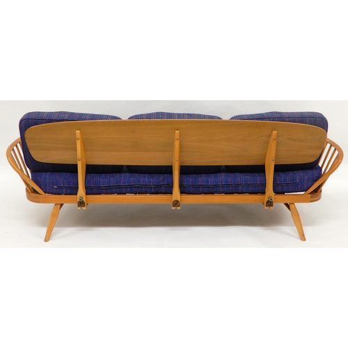 2109 - A MID 20TH CENTURY ELM AND BEECH FRAMED ERCOL DAY BEDwith blue upholstered cushions, 76cm high x 209... 