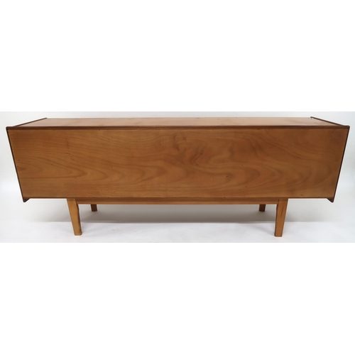 2113 - A MID 20TH CENTURY TEAK SIDEBOARDwith three long central drawers flanked by cabinet doors with diamo... 