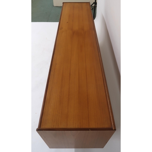 2113 - A MID 20TH CENTURY TEAK SIDEBOARDwith three long central drawers flanked by cabinet doors with diamo... 