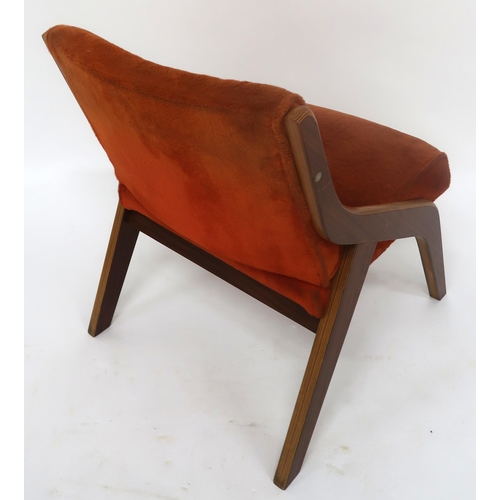 2114 - A MID 20TH CENTURY NEIL MORRIS FOR MORRIS OF GLASGOW LOUNGE CHAIRwith a laminated Formosa Teak frame... 
