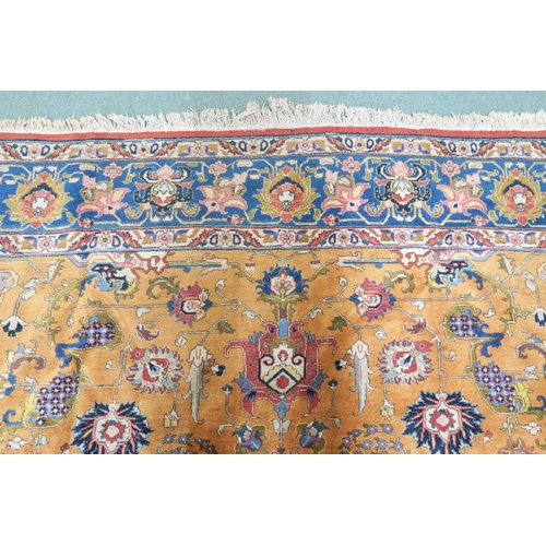 2130 - A LARGE MUSTARD GROUND HERIZ RUGwith dark blue central medallion, floral pattern ground and light bl... 