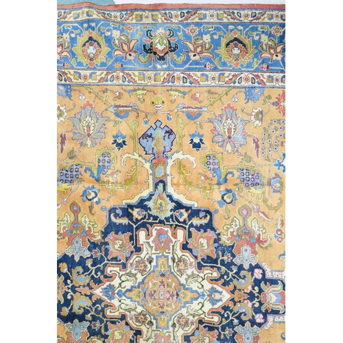 2130 - A LARGE MUSTARD GROUND HERIZ RUGwith dark blue central medallion, floral pattern ground and light bl... 