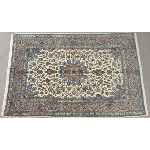 2137 - A CREAM GROUND MESHED RUGwith multicolour flower head central medallion, matching spandrels and flow... 